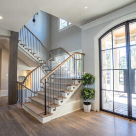 L shaped staircase with white oak treads and handrail, with iron balusters