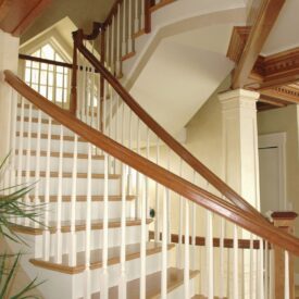 Custom Circular Switchback Staircase with red oak stained parts
