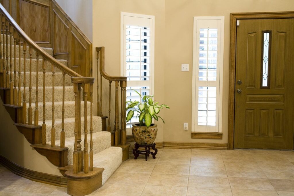 Custom Red Oak Curved Staircase with wooden newels and balusters