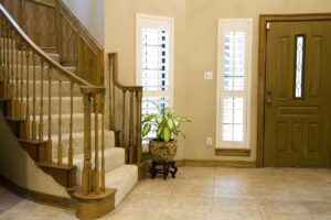 Custom Red Oak Curved Staircase with wooden newels and balusters
